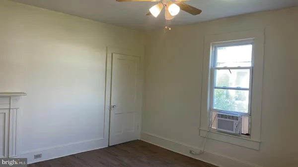 a kitchen with granite countertop cabinets and window