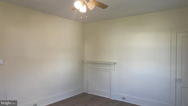 a kitchen with a stove top oven and refrigerator