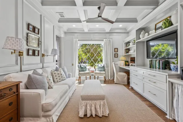 a kitchen with a stove cabinets and wooden floor