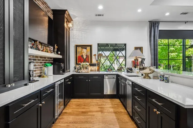 a living room with fireplace furniture and a large window