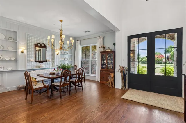 a view of a dining room with furniture and window
