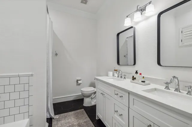 a bed room with a bed and a chair