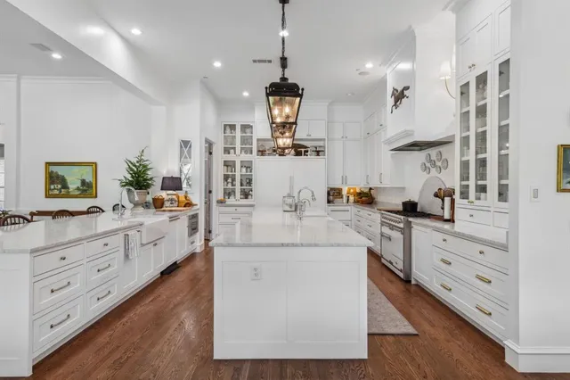 a living room with furniture a fireplace and a large window