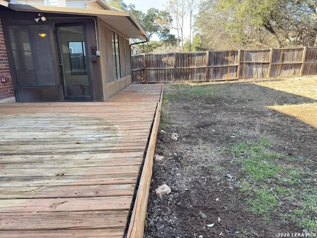 a view of swimming pool with a yard and large trees