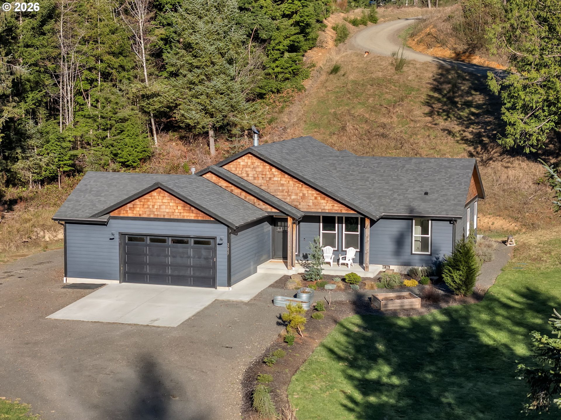 37027 Danner Ridge Lane Astoria, OR 97103 - Photo 2 of 46 front view of house with a yard