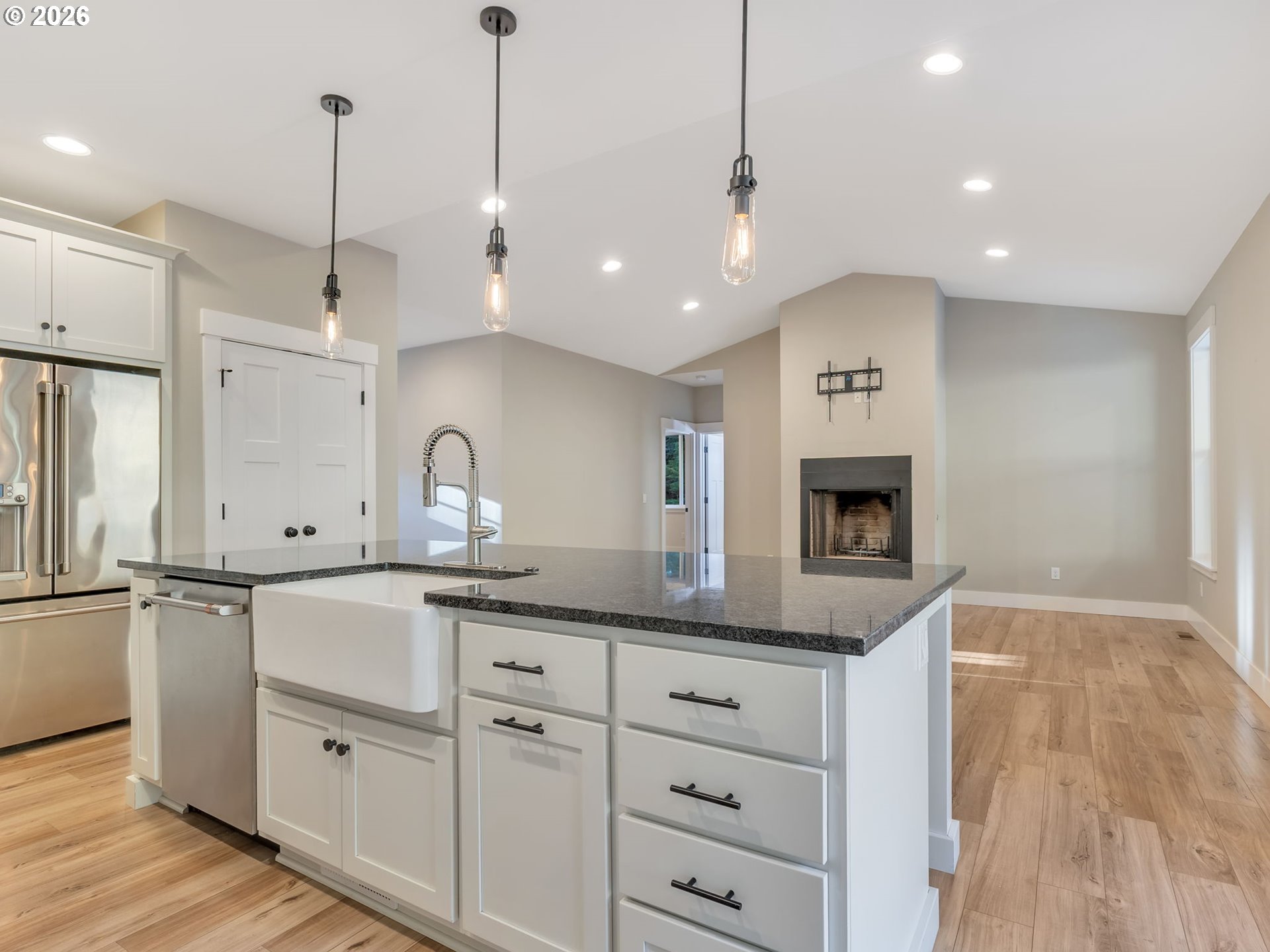 37027 Danner Ridge Lane Astoria, OR 97103 - Photo 21 of 46 a kitchen with kitchen island a sink stainless steel appliances and cabinets