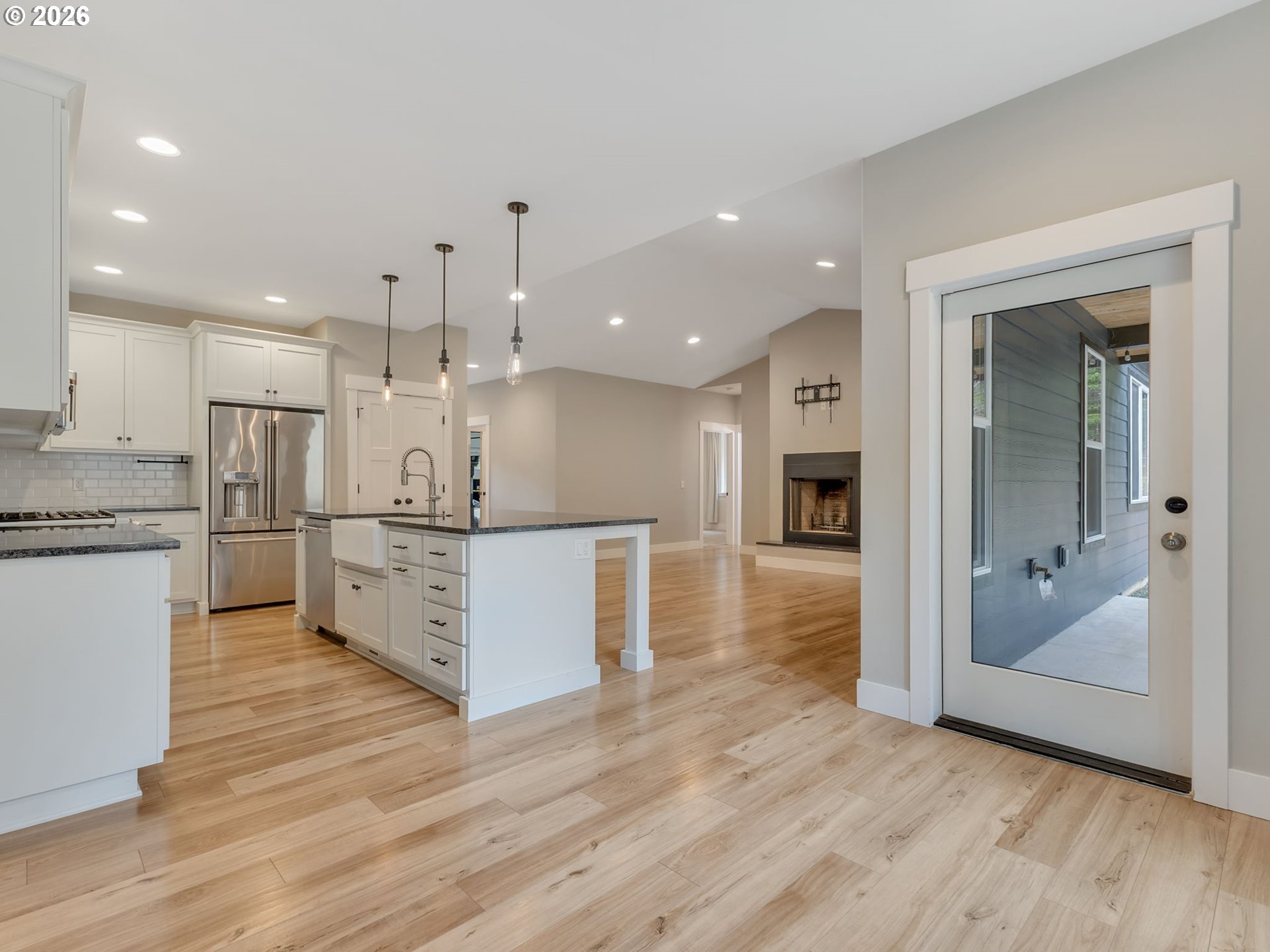 37027 Danner Ridge Lane Astoria, OR 97103 - Photo 24 of 46 a large kitchen with a center island and stainless steel appliances