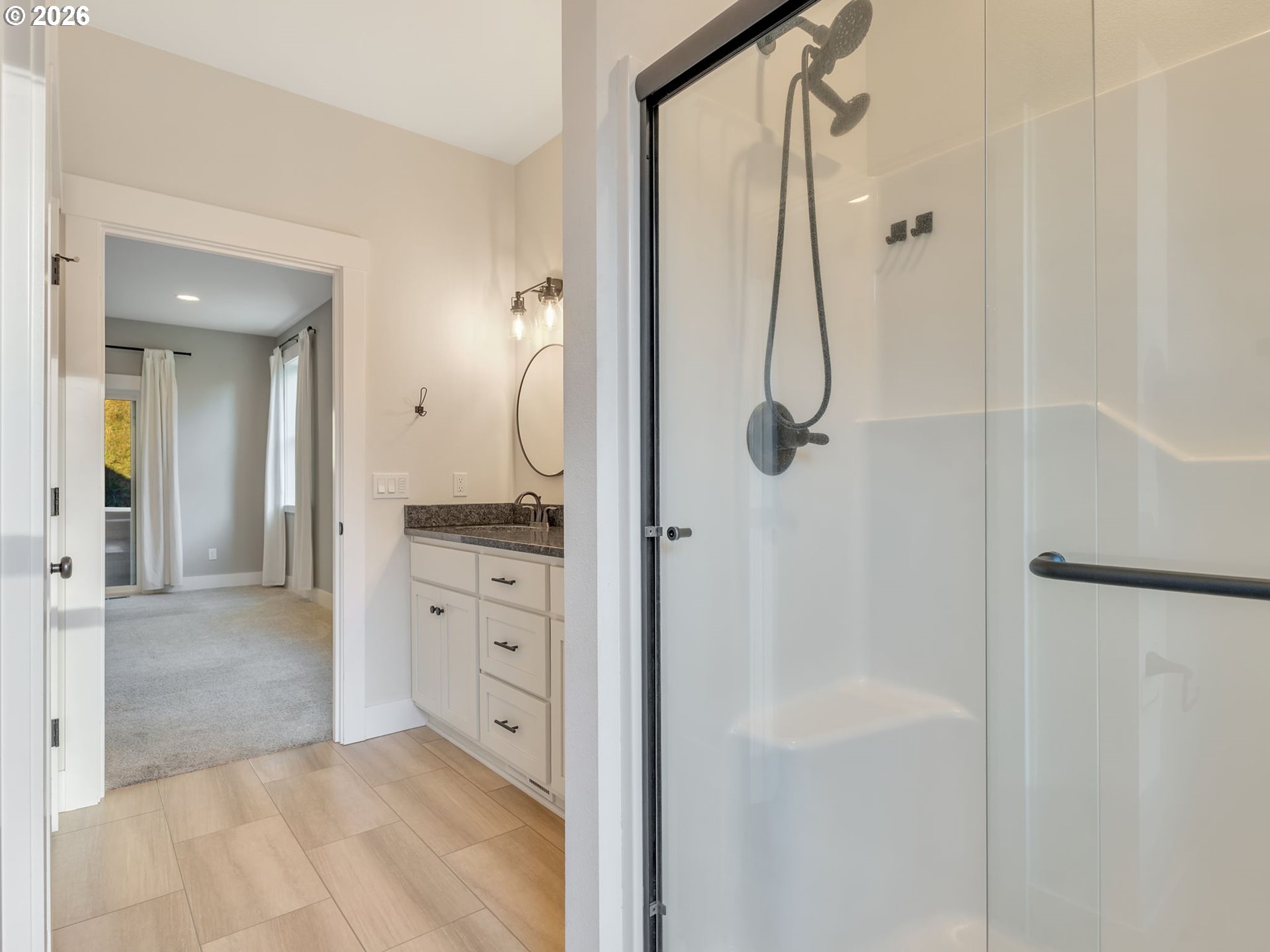 37027 Danner Ridge Lane Astoria, OR 97103 - Photo 29 of 46 a bathroom with a granite countertop shower mirror and a sink