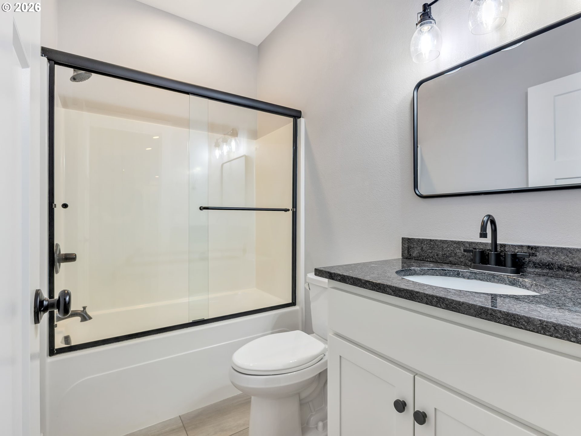 37027 Danner Ridge Lane Astoria, OR 97103 - Photo 37 of 46 a bathroom with a granite countertop sink toilet and shower