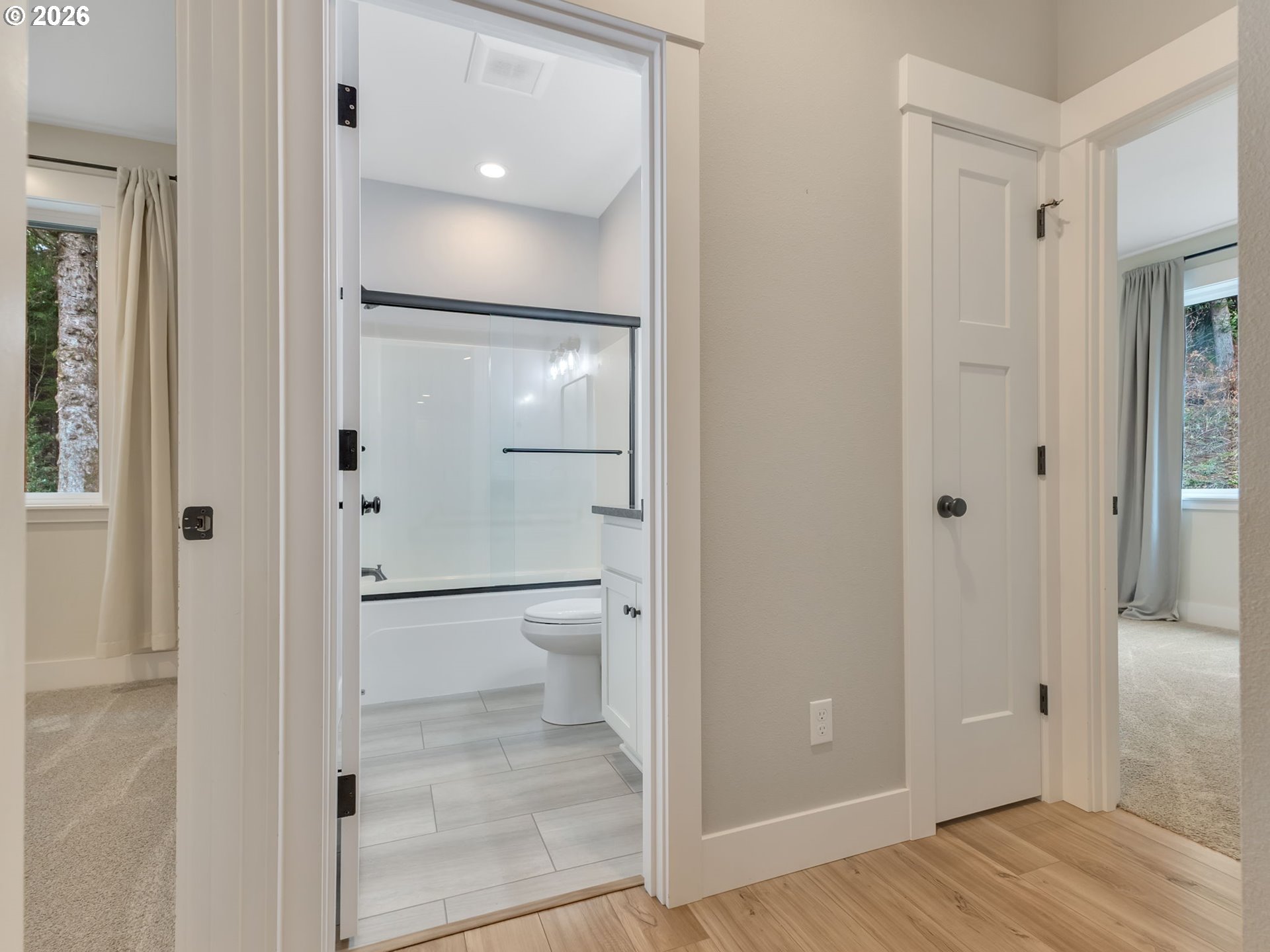37027 Danner Ridge Lane Astoria, OR 97103 - Photo 38 of 46 a bathroom with a glass shower door
