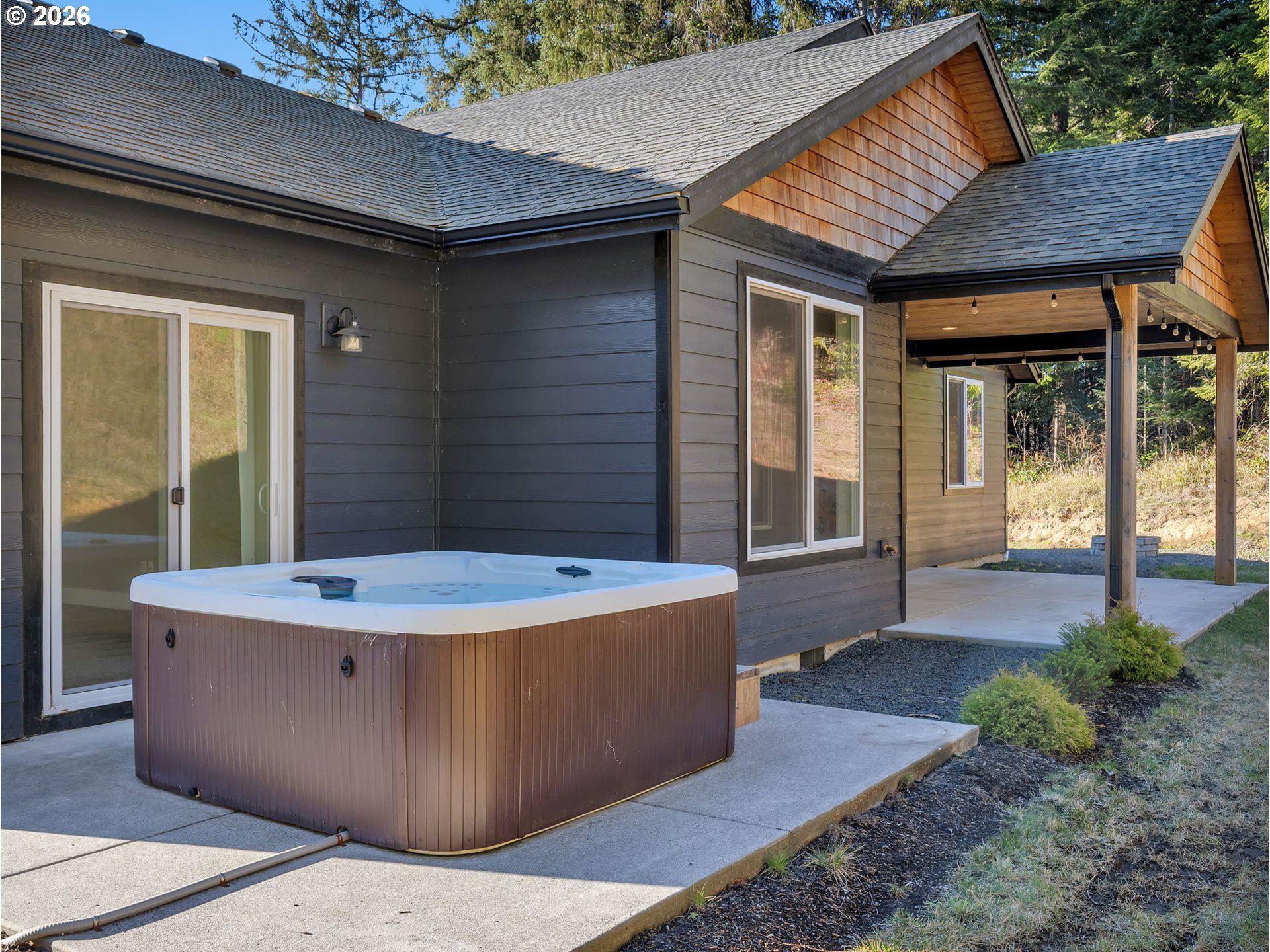 37027 Danner Ridge Lane Astoria, OR 97103 - Photo 45 of 46 a view of a backyard with a tub and garden