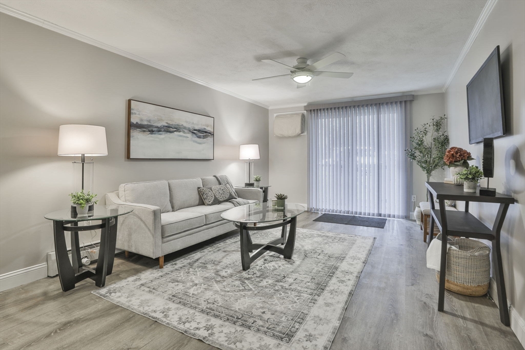 5 Karen Circle, Unit 4 Billerica, MA 01821 - Photo 2 of 12 a living room with furniture and a rug