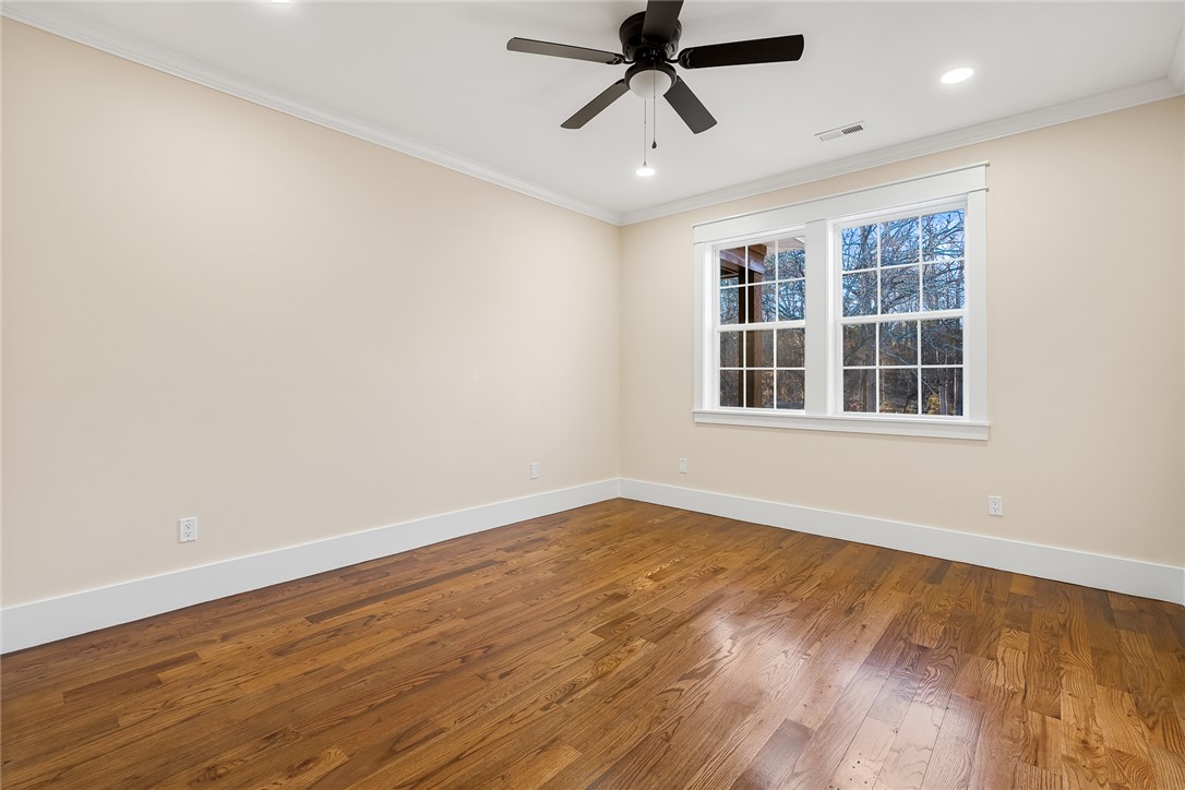 303 Regency Circle Anderson, SC 29625 - Photo 32 of 50 This spacious room features ample natural light and elegant hardwood flooring.