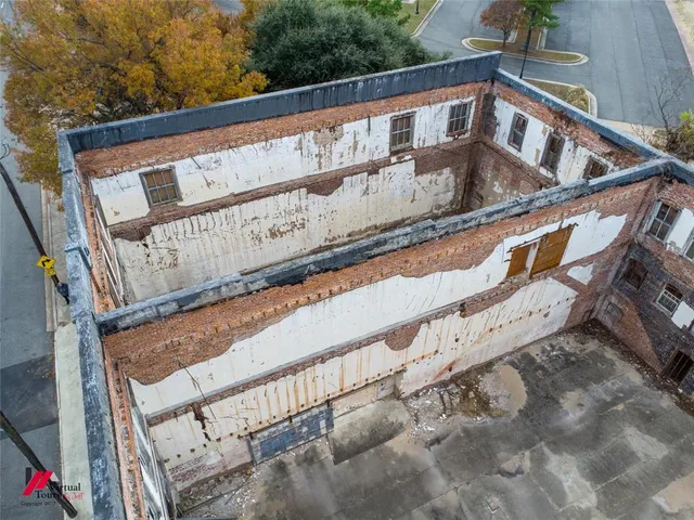a large building with a yard in front of it