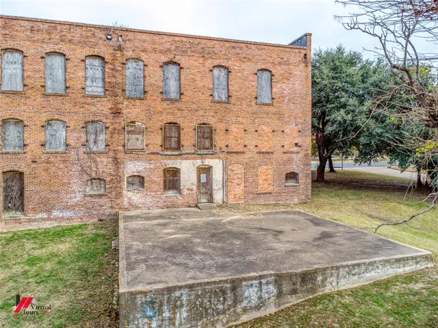 a large building with river in front of it