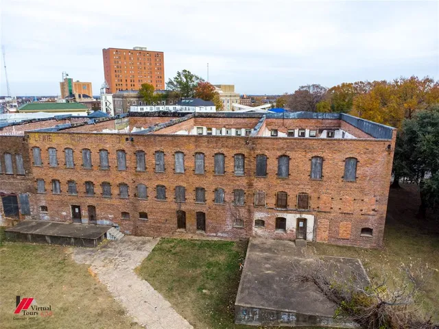 a view of a building with a street