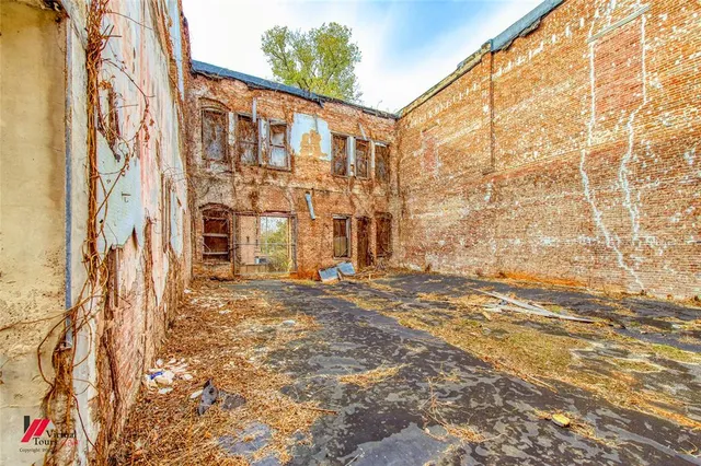 a view of a balcony with wooden fence