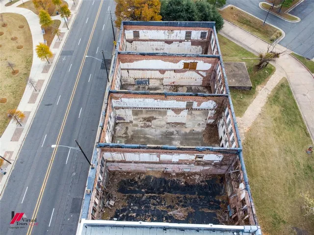 an aerial view of a swimming pool and outdoor space