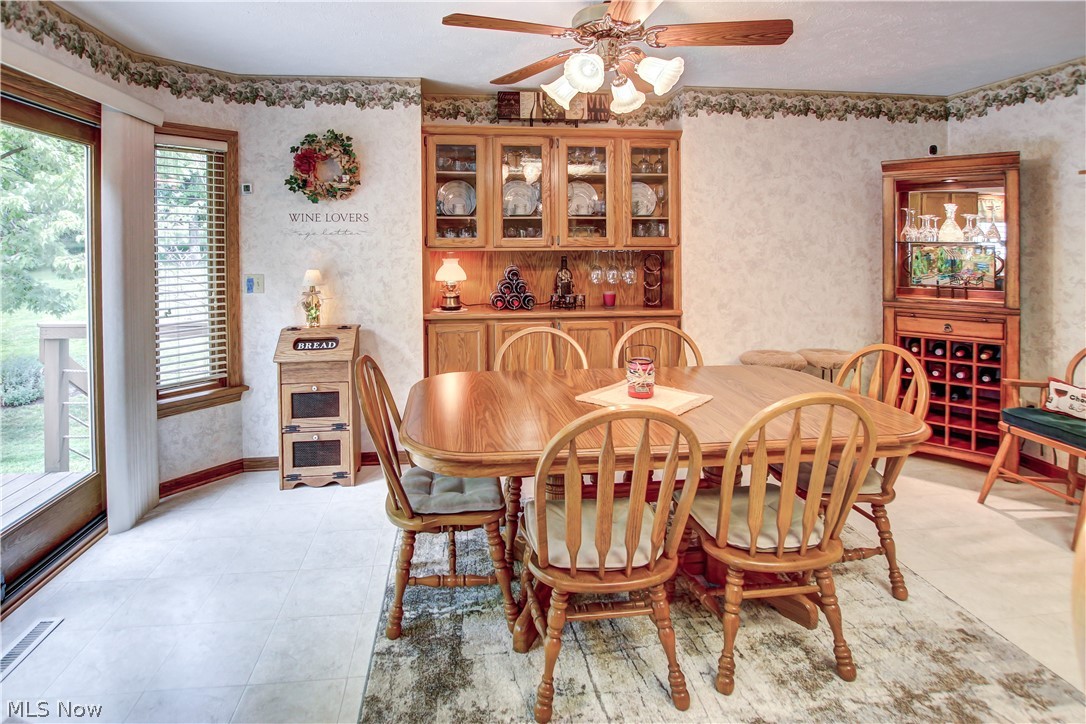 1010 Rustic Trail Cleveland, OH 44134 - Photo 8 of 49 Dining area featuring ceiling fan, a healthy amount of sunlight, and light tile floors