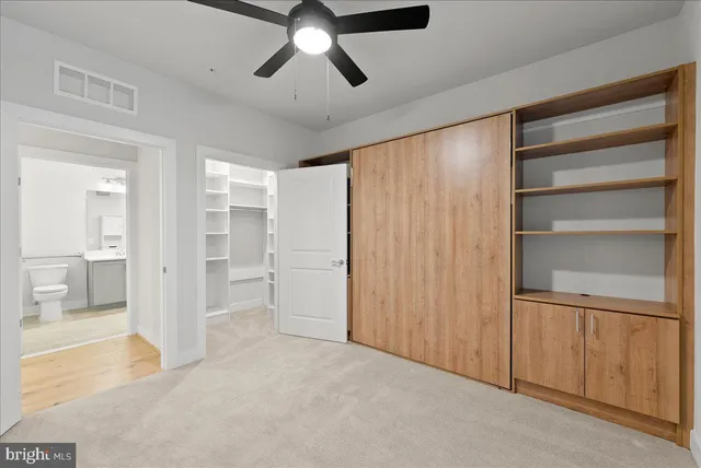 a view of an empty room with a cabinet