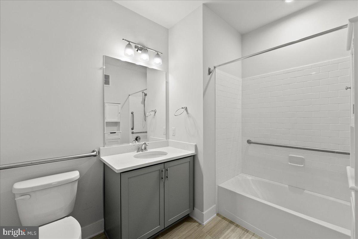 2320 Field Point Road, Unit 103 Herndon, VA 20171 - Photo 14 of 22 a bathroom with a sink toilet and shower