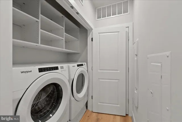 a view of a hallway with washer and dryer