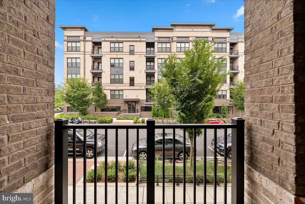 2320 Field Point Road, Unit 103 Herndon, VA 20171 - Photo 20 of 22 a view of a large building from a balcony