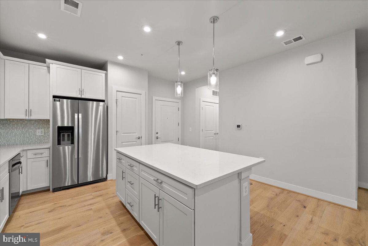 2320 Field Point Road, Unit 103 Herndon, VA 20171 - Photo 4 of 22 a kitchen with a refrigerator a sink and a oven