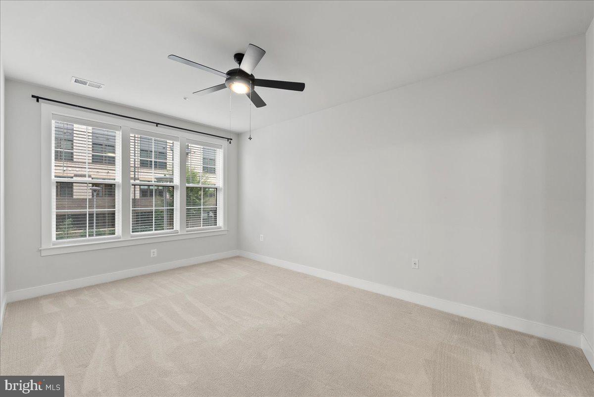 2320 Field Point Road, Unit 103 Herndon, VA 20171 - Photo 6 of 22 a view of an empty room with a window