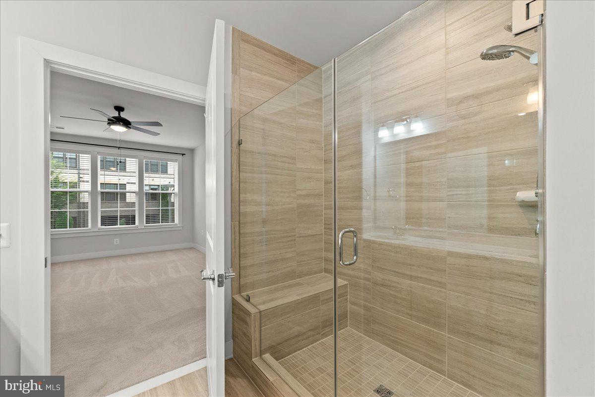 2320 Field Point Road, Unit 103 Herndon, VA 20171 - Photo 10 of 22 a bathroom with a glass shower door