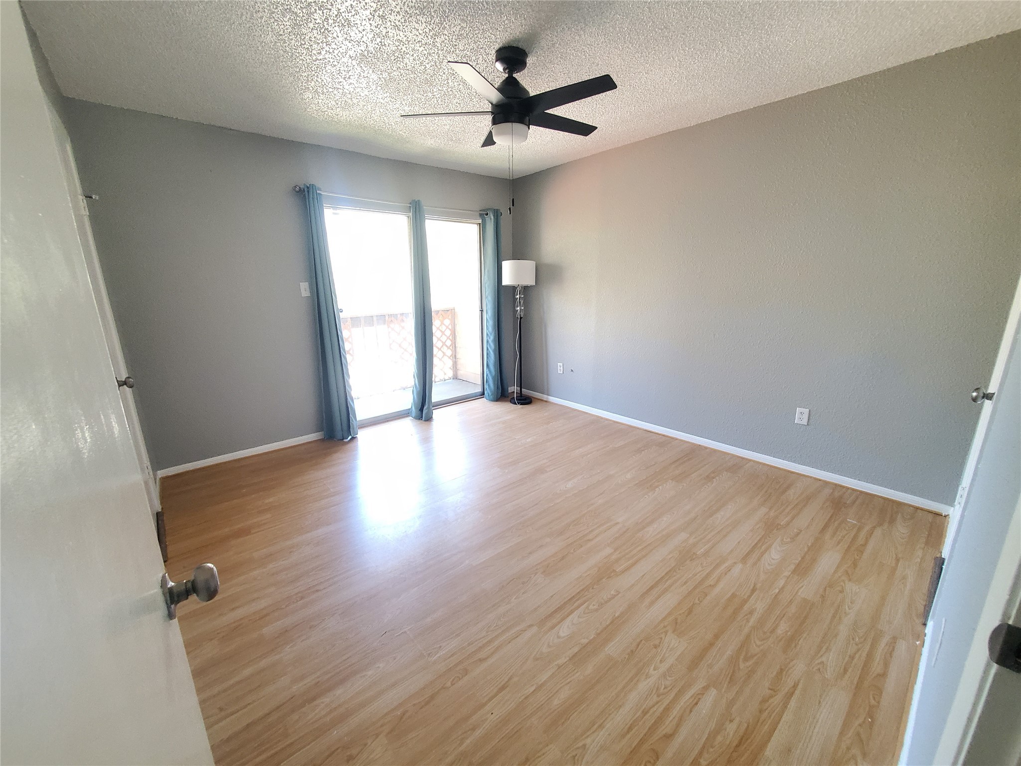 1505 Ward Road, Unit 218 Baytown, TX 77520 - Photo 11 of 17 wooden floor in an empty room with a window