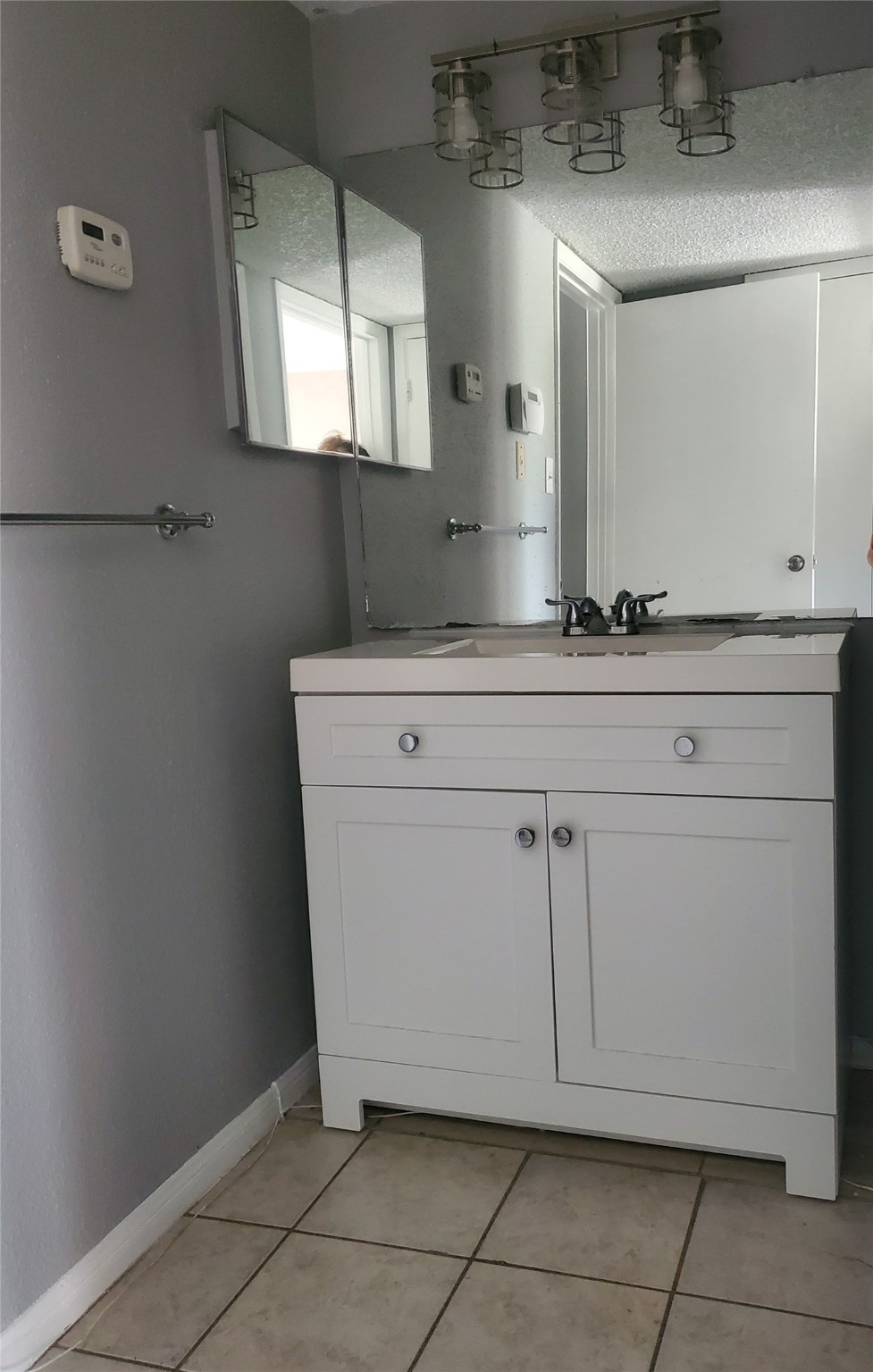 1505 Ward Road, Unit 218 Baytown, TX 77520 - Photo 14 of 17 a bathroom with a sink and a mirror
