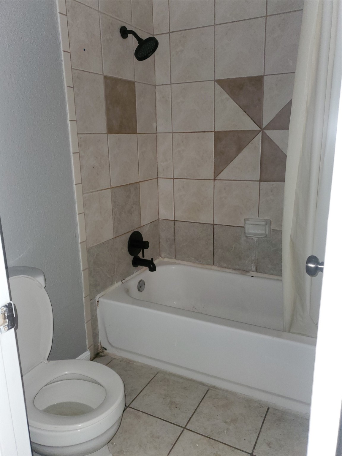 1505 Ward Road, Unit 218 Baytown, TX 77520 - Photo 15 of 17 a white toilet sitting next to a bath tub and shower