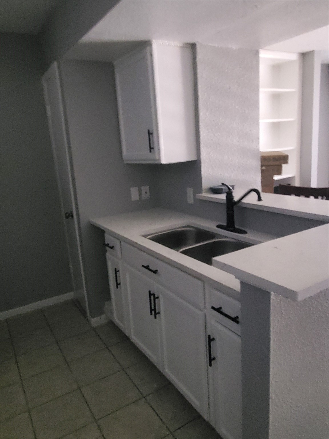 1505 Ward Road, Unit 218 Baytown, TX 77520 - Photo 7 of 17 a kitchen with a sink cabinets and window