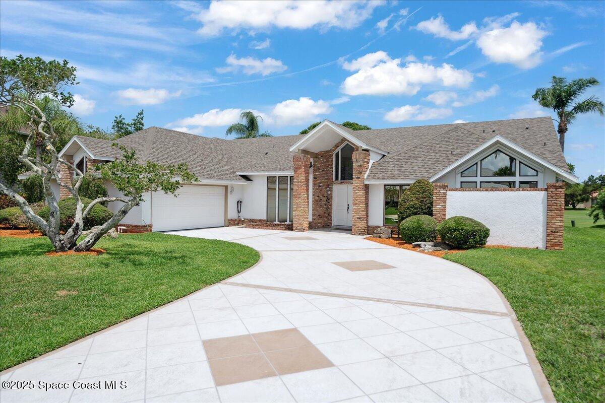 649 Spring Lake Drive Melbourne, FL 32940 - Photo 1 of 47 a front view of a house with a yard