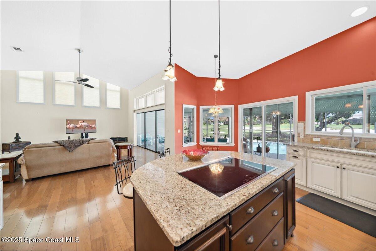 649 Spring Lake Drive Melbourne, FL 32940 - Photo 15 of 47 a living room with furniture and a large window