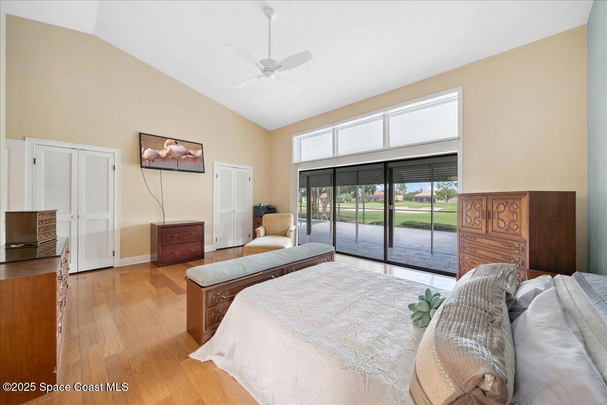 649 Spring Lake Drive Melbourne, FL 32940 - Photo 17 of 47 a bedroom with a bed and a large window