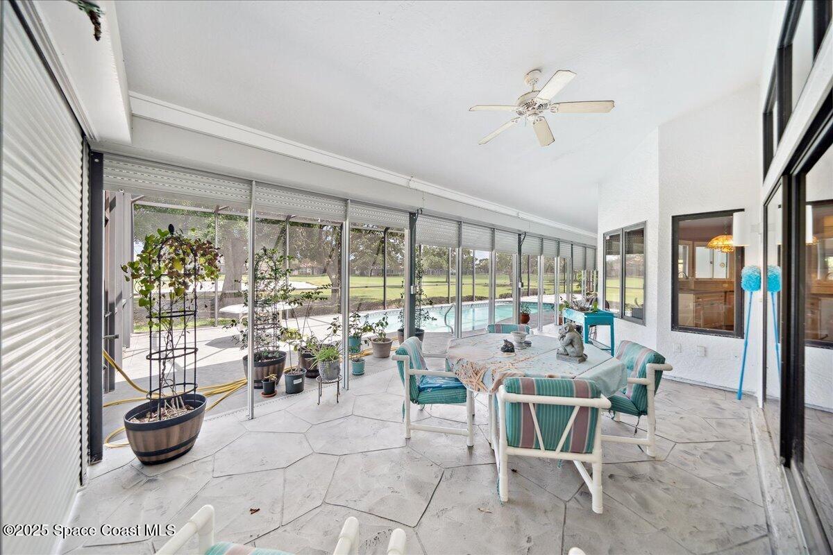 649 Spring Lake Drive Melbourne, FL 32940 - Photo 27 of 47 a dining room with furniture water view and a potted plant