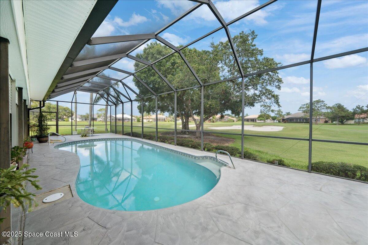 649 Spring Lake Drive Melbourne, FL 32940 - Photo 30 of 47 a view of a swimming pool with a backyard