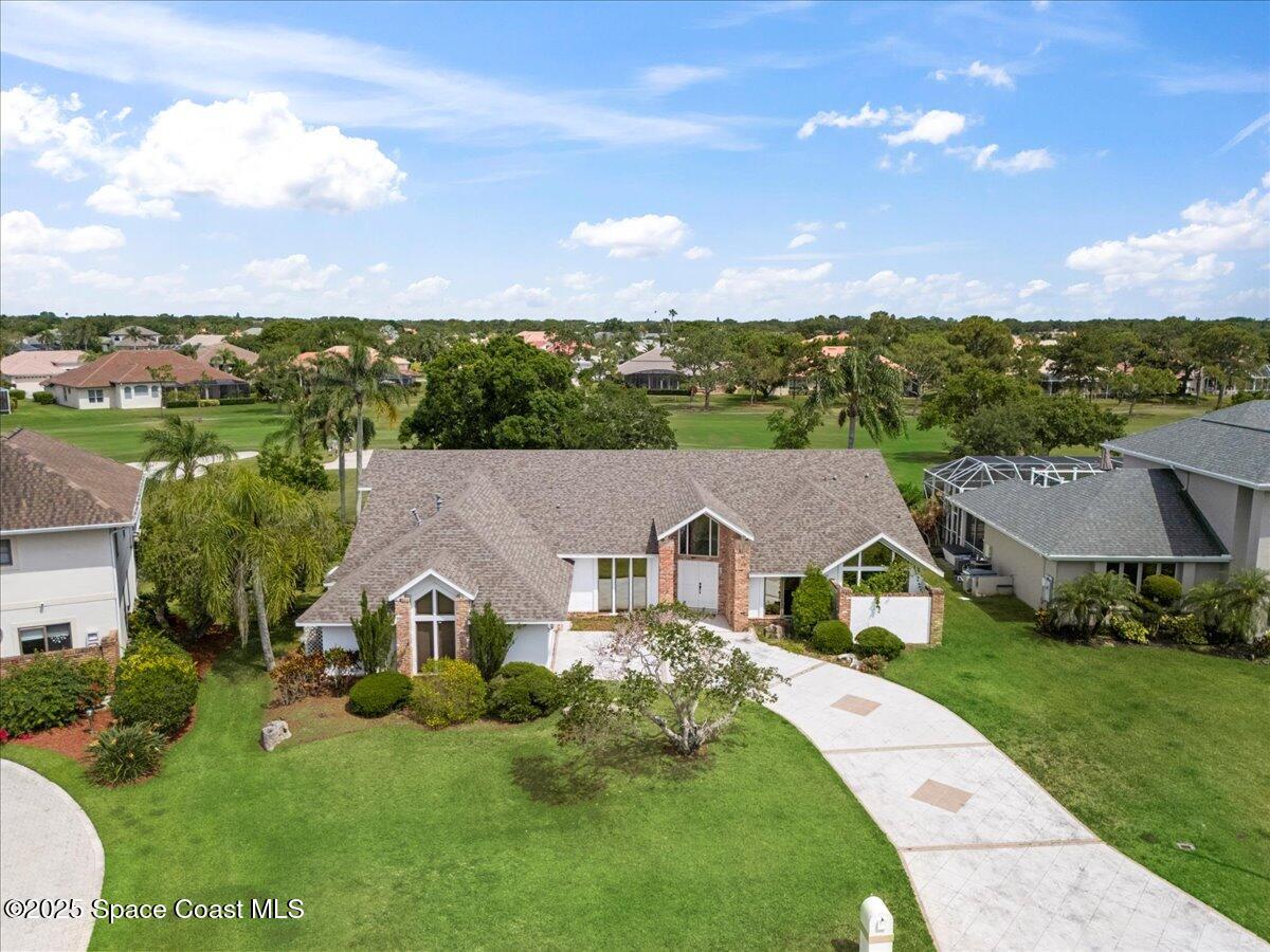 649 Spring Lake Drive Melbourne, FL 32940 - Photo 3 of 47 a view of house with garden space and street view