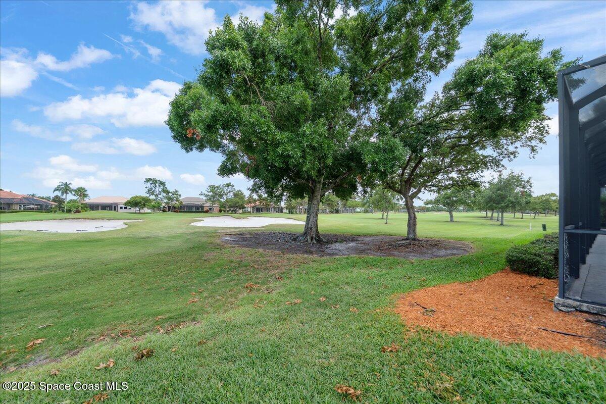 649 Spring Lake Drive Melbourne, FL 32940 - Photo 34 of 47 a view of a park with large trees