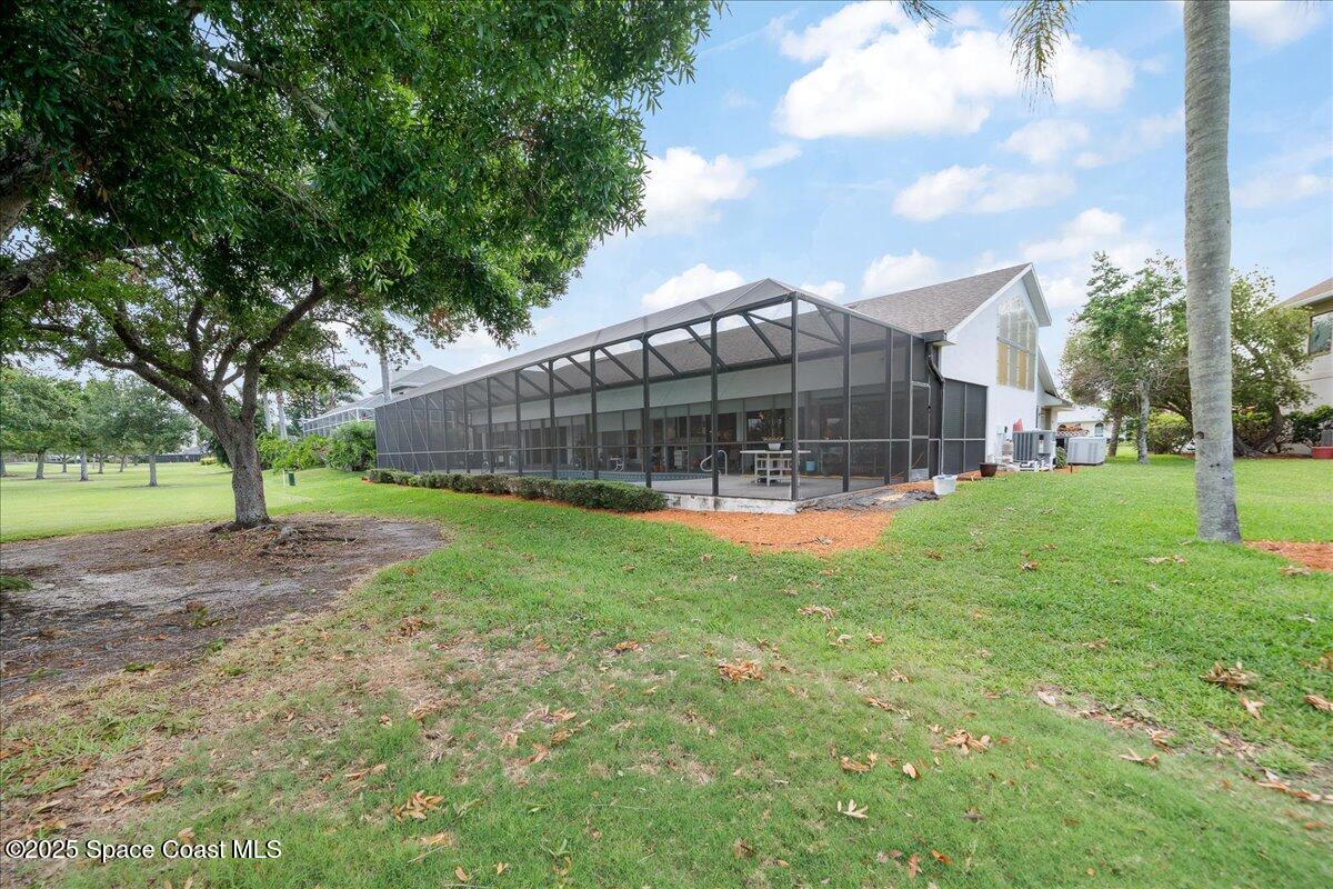 649 Spring Lake Drive Melbourne, FL 32940 - Photo 35 of 47 a view of a house with a backyard
