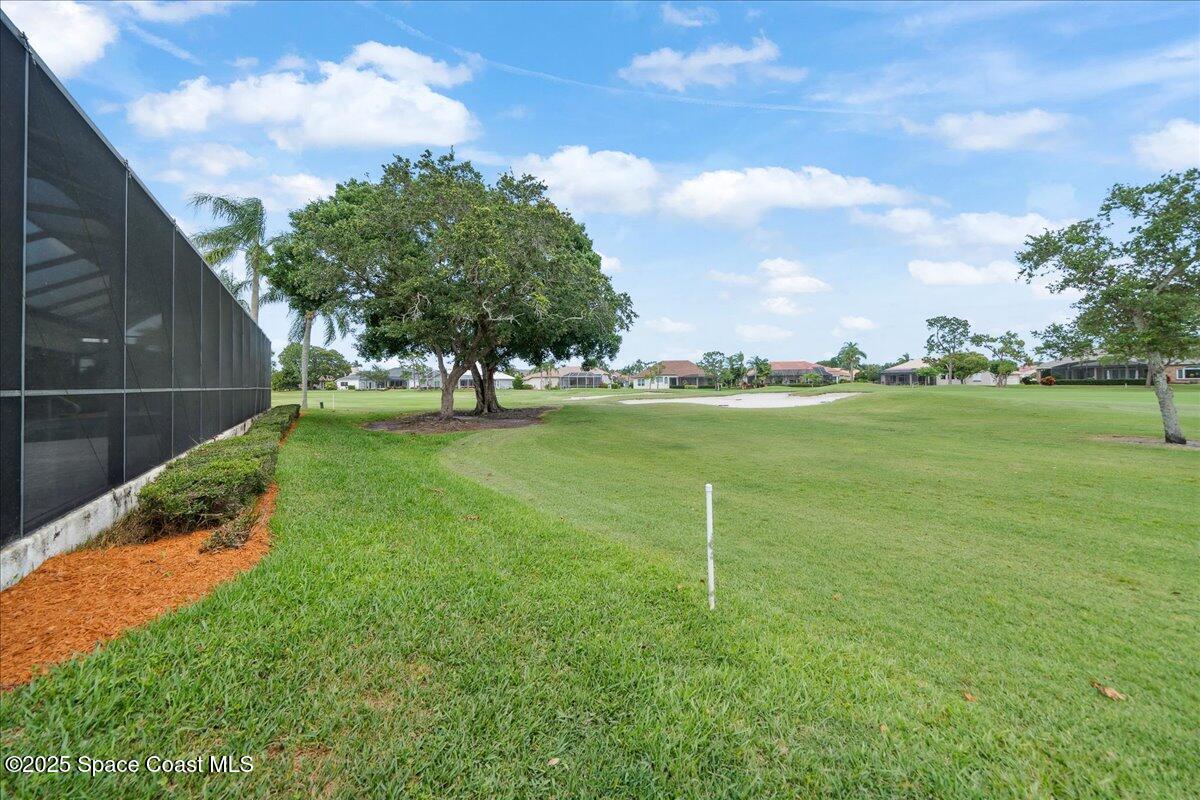 649 Spring Lake Drive Melbourne, FL 32940 - Photo 36 of 47 a view of a golf course with a garden