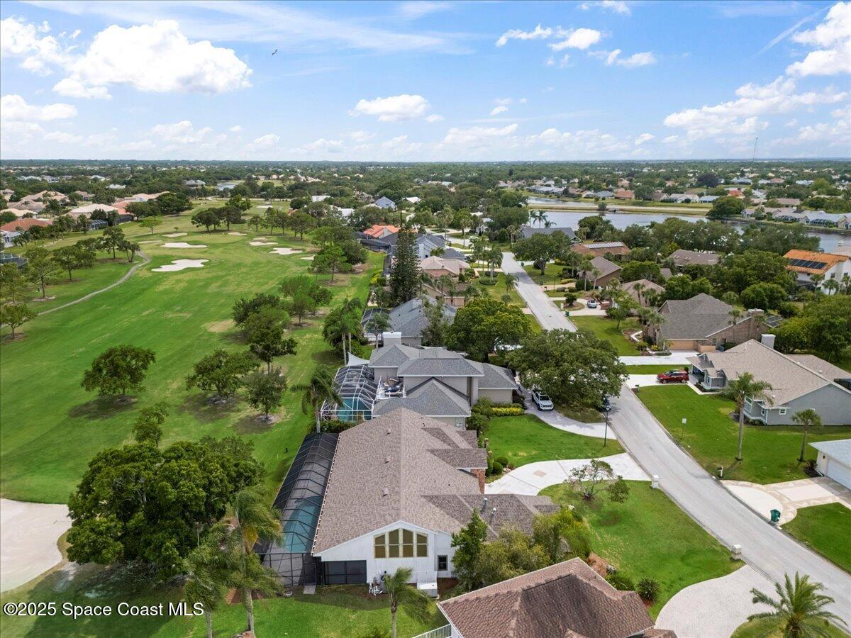 649 Spring Lake Drive Melbourne, FL 32940 - Photo 37 of 47 an aerial view of residential houses with outdoor space and trees