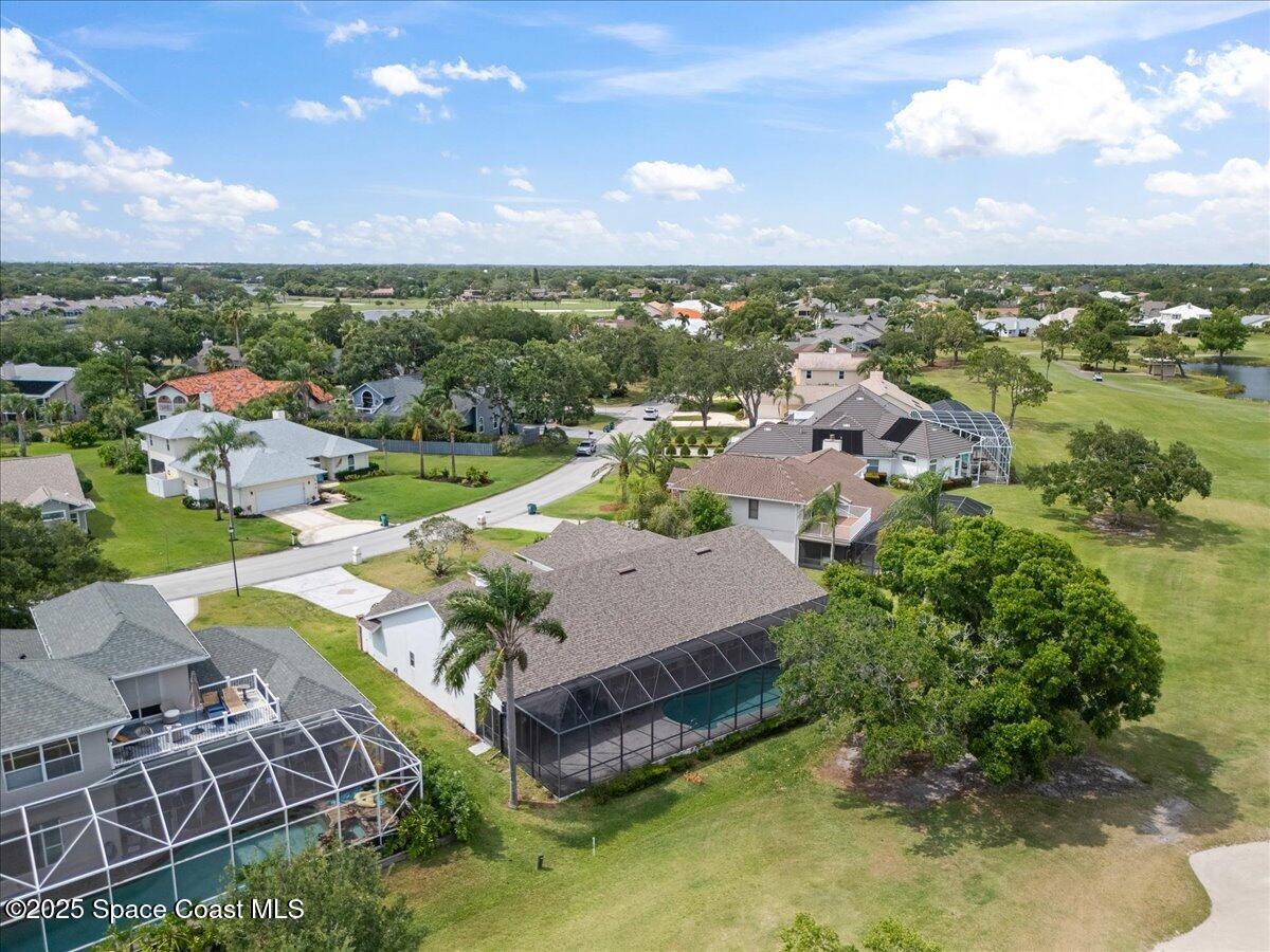 649 Spring Lake Drive Melbourne, FL 32940 - Photo 38 of 47 an aerial view of a house with a garden