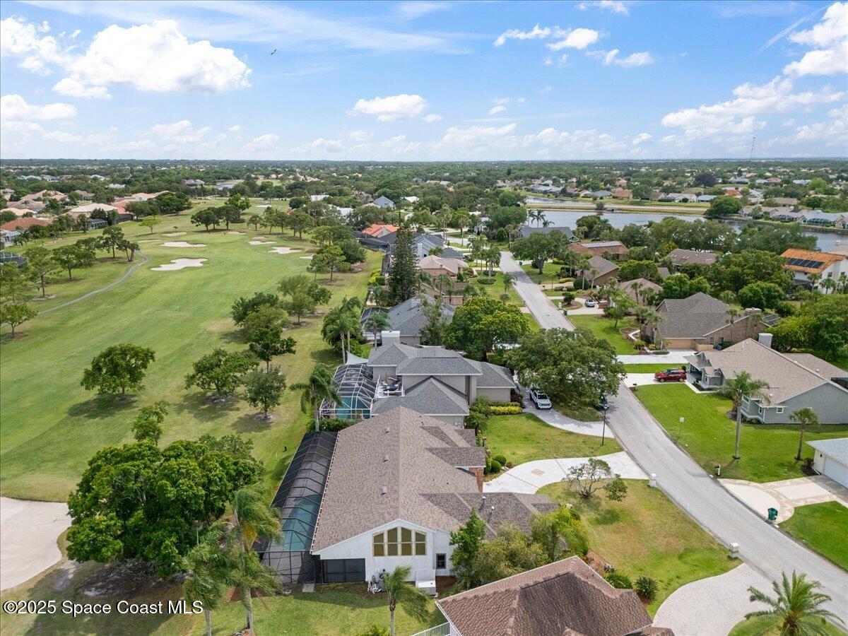 649 Spring Lake Drive Melbourne, FL 32940 - Photo 40 of 47 an aerial view of residential houses with outdoor space