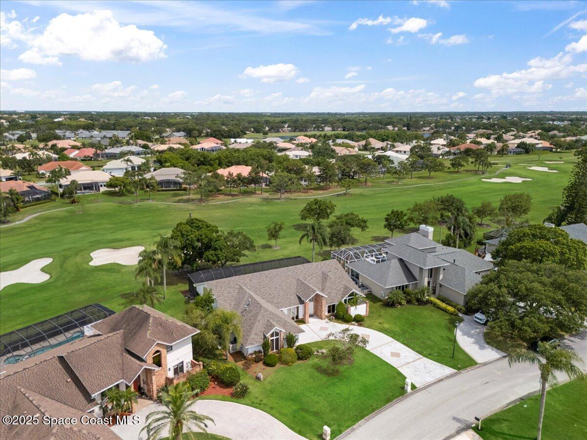 649 Spring Lake Drive Melbourne, FL 32940 - Photo 45 of 47 an aerial view of a house with a garden