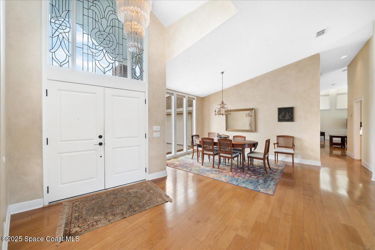 649 Spring Lake Drive Melbourne, FL 32940 - Photo 5 of 47 a living room with furniture and wooden floor