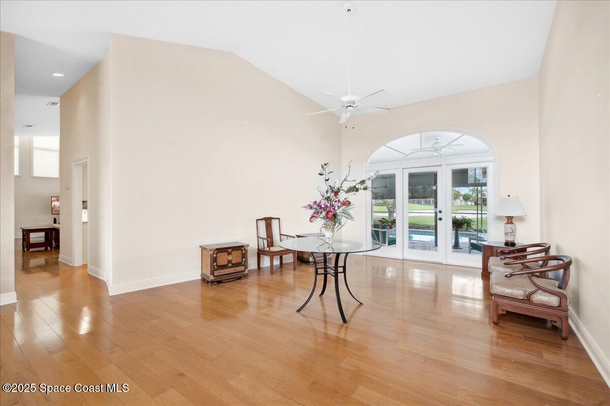 649 Spring Lake Drive Melbourne, FL 32940 - Photo 6 of 47 a living room with furniture and a large window