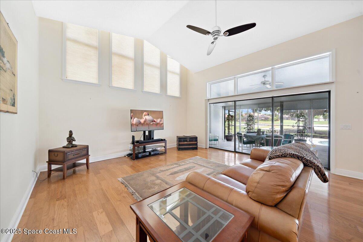 649 Spring Lake Drive Melbourne, FL 32940 - Photo 10 of 47 a living room with furniture and a large window